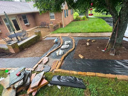 Flagstone walkway under construction before completion