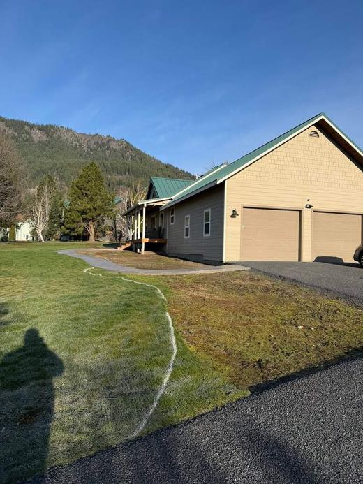 Marked out lawn area near garage before landscaping work